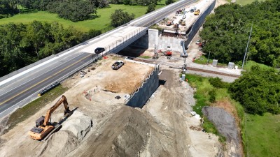 Looking southwest at construction of a new bridge for westbound SR 50 traffic (7-28-2025 photo)