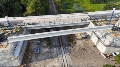 Beam one for the westbound SR 50 bridge being positioned into place (8-23-2025 photo @ 8:32 a.m.)