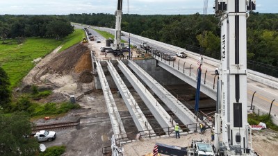 The last bridge beam for the westbound SR 50 bridge is set into place (8-23-2025 photo @ 2:29 p.m.)
