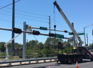 Installing mast arms for traffic signals and signs at the intersection of SR 54 and Old CR 54 (May 11, 2020 photo)