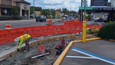 Image showing construction worker installing new concrete curb along SR 60 (Kennedy Blvd) Photo May 2026