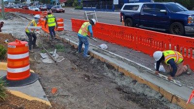 Image showing construction workers installing new concrete curb along SR 60 (Kennedy Blvd) Photo May 2026