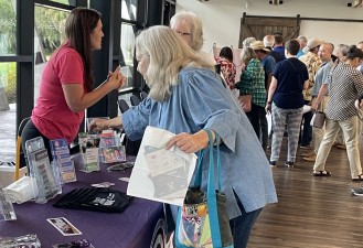 Visitors to the public open house picked up roundabout and safety information and viewed project plans with staff (9/10/2024 photo)