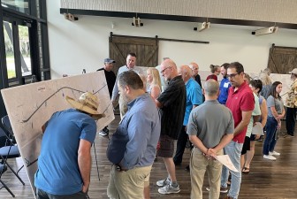 Visitors talk with project team members and view project plans during a public open house for the project (9/10/2024 photo)