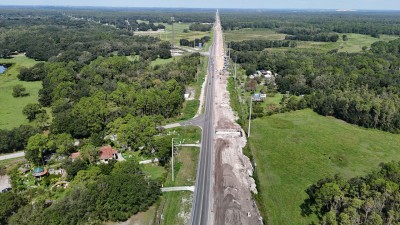 Looking northwest over US 98 approaching CR 54 towards the upper portion of the photo (8-29-2025 photo)