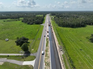 Looking southeast over US 98 at paving new southbound lanes, south of Keen Road (7-31-2026 photo)