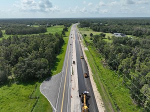 Looking southeast over US 98 at paving new southbound lanes, south of Keen Road (7-31-2026 photo)