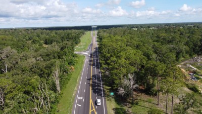 Looking northwest over US 98 at the completed roadway toward the north end of the project  (5-29-2026 photo)