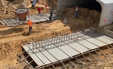 Pouring concrete for segment footers (9/8/2021 photo)