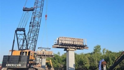 Crane sets main support beams (March 2026 photo)