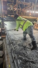 Crews work to smooth the concrete on the deck span north of SR 60 (February 2026 photo)