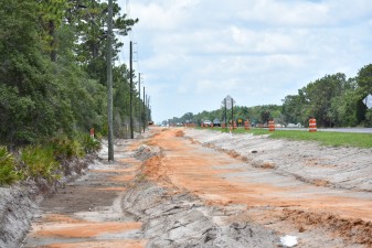 Looking south at earthwork for pedestrian trail construction (6/14/2021 photo)