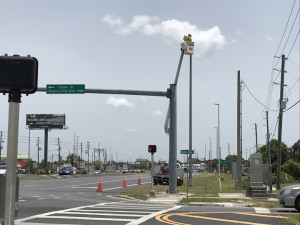 Contractor is replacing old light fixtures with new LED fixtures at the NE corner of Regency Park Blvd./Cinema Dr. and US 19 in Pasco County (June 2020 photo)