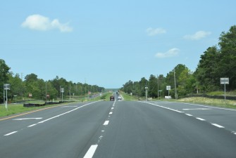 New pavement and markings on westbound US 98 approaching Lone Pine Street (5-19-2025 photo)