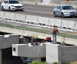 Workers prepare a pier for beams that will be set soon over SR 60 (3/16/20 photo)