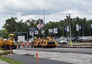 Workers pave a base layer of asphalt on southbound US 41 just south of Wiscon Road. Concrete will be placed over this area for the final roadway surface (8/27/2021 photo)