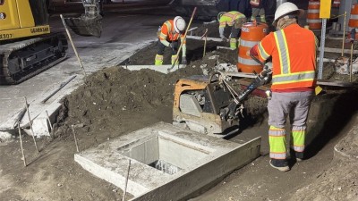 Crews compacting earth around newly installed concrete utility box on SR 60 west of Parson Road (Photo May 2026)
