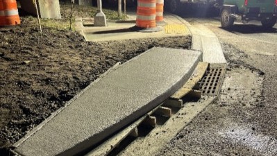 Newly poured concrete curb on SR 60 west of Parson Road (Photo June 2026)