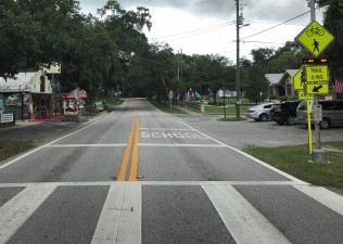 Safety enhancements at the CR 48 trail crossing included rapid flashing beacons to alert drivers that people are crossing the road (June 2021 photo)