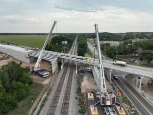 Setting a concrete I-beam for a new US 98 bridge over the railroad tracks next to Old Lakeland Highway (5-12-2026 photo)