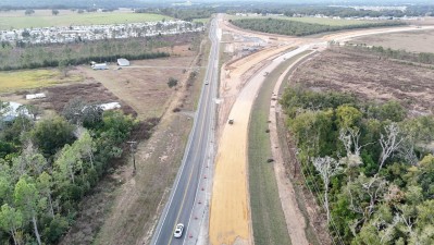 Looking north over US 98 at construction of the new alignment going off toward the right (12-3-2025 photo)