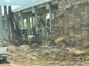Installing temporary wall for new bridge construction over Old Lakeland Highway and the railroad tracks (9-6-2025 photo)