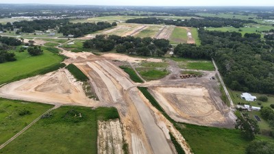Looking north at US 98 realignment and pond construction south of Clinton Avenue (6-29-2025 photo)