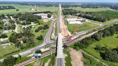 Looking northwest over US 98 at the bridge over the railroad tracks and Old Lakeland Highway (8-30-2025 photo)