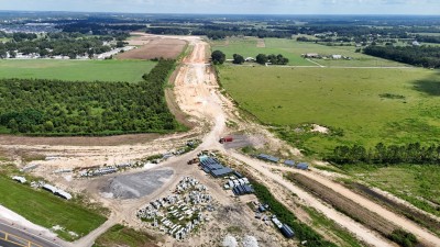 Looking north from US 98 at construction of the new alignment (8-30-2025 photo)