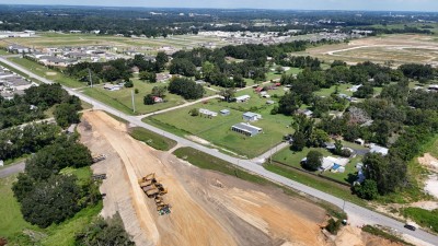 Looking northwest over construction of the new US 98 where it will tie into Clinton Avenue (8-30-2025 photo)
