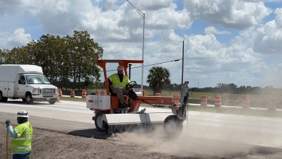Image showing crews cleaning shoulder lane with broom truck (Photo March 2026)