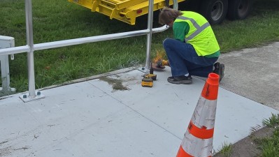Image showing crews installing handrails along section of sidewalk at the intersection of SR 60 and SR 39 (Photo June 2026)