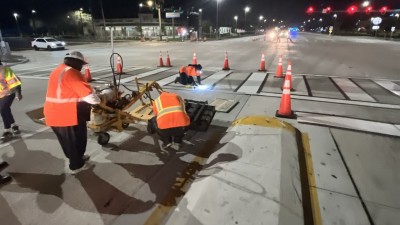 Crews adding roadway marking to travel lanes on US 301 at Gibsonton Drive in Riverview (February 2026 photo)