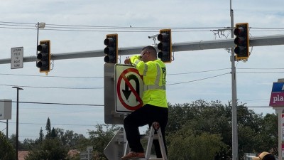 Crews installing signs at the intersection of US 301 at Gibsonton Drive (June 2026 photo)