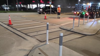 Crews installing roadway delineators at US 301 and Gibsonton Drive (August 2026 photo)