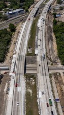 Image of southbound and northbound I-75 travel lanes showing widening construction to the outside of the interstate (Photo April 2026)