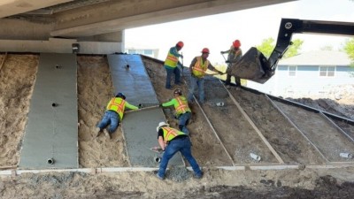 Crews performing concrete slope work under I-275 overpass (Photo March 2026)