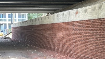 Image showing newly completed brick wall as part of the Downtown Tampa Interchange project (photo July 2026)