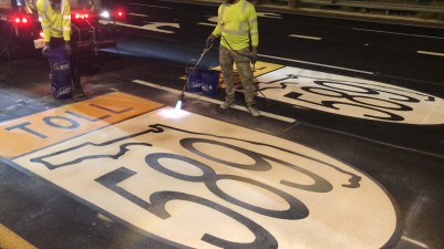 Westbound SR 60 toward SR 589 crews placing interstate shields (photo May 2026)
