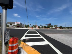Looking west across US 19 at a new mid-block crossing that is expected to open in July at San Marco Drive / Johnson Road (5/31/2025 photo)