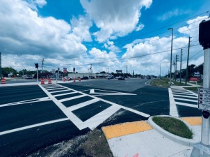 Looking southeast across US 19 at a new mid-block crossing that is expected to open in July at San Marco Drive / Johnson Road (5/31/2025 photo)