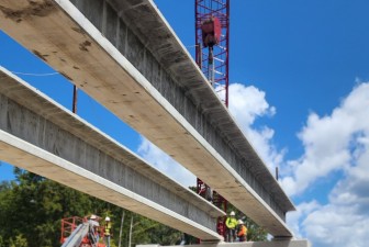 Cranes are setting a bridge beam into place on the south side of the Withlacoochee River (8-17-2026 photo)