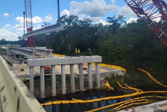 Cranes are setting a bridge beam into place on the south side of the Withlacoochee River (8-17-2026 photo)