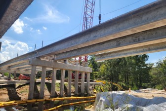 Setting bridge beam number three over the Withlacoochee River (8-18-2026 photo)