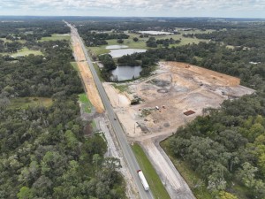 Looking southwest over US 301 at storm water pond construction north of Globe Road (10-15-2025 photo)