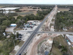 Looking north over US 301 at roadway widening and roundabout construction at Trilby Road / SR 575 (1-13-2026 photo)