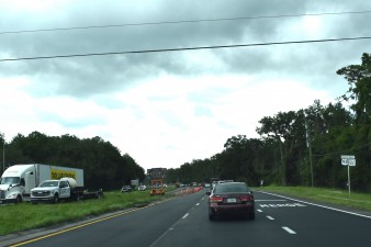 Lane closures are set up for operations to mill the old asphalt ahead (7-21-2025 photo)