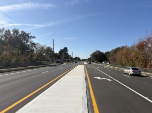 Final concrete median, asphalt, and striping (12-19-2025 photo)