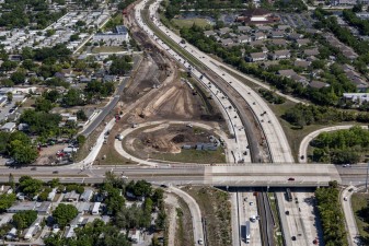 Looking north over the 54th Ave N interchange where ramp reconstruction is underway in the northwest corner (4-15-2026 photo)