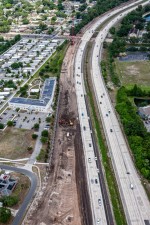 Looking north over I-275, north of 54th Avenue N at ramp and noise barrier construction (5-14-2026 photo)